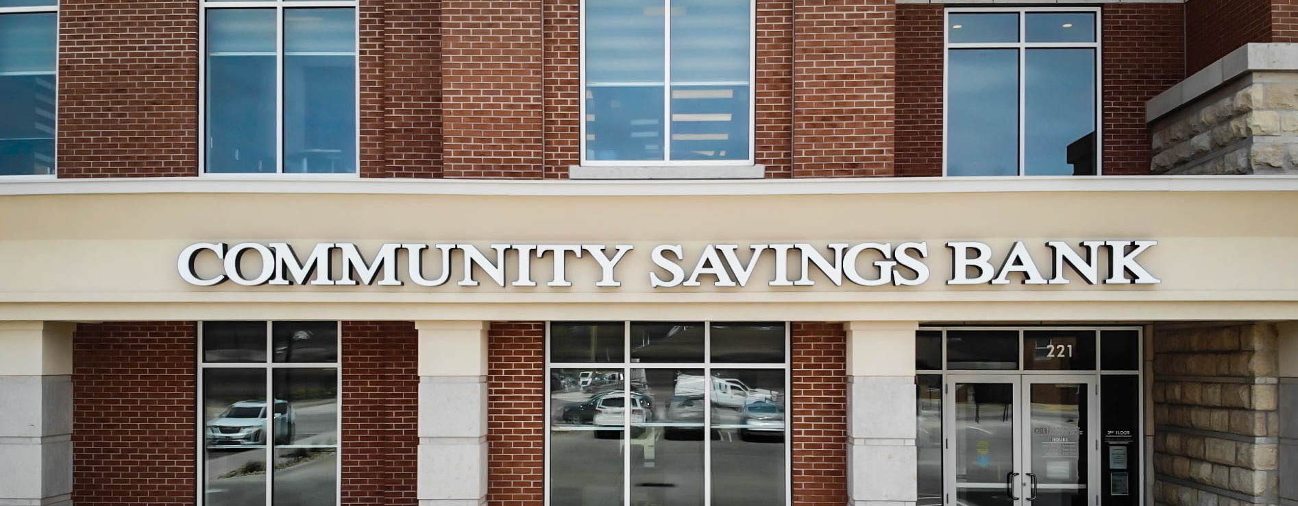 An image of the Community Savings Bank sign on one of their buildings.